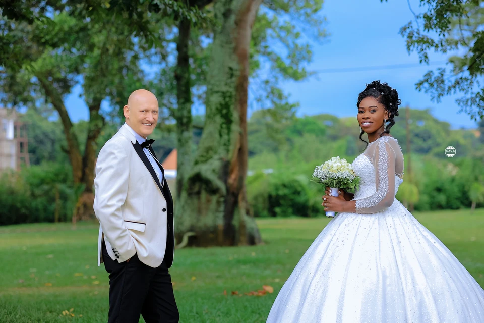 Bride and groom in a sunny garden